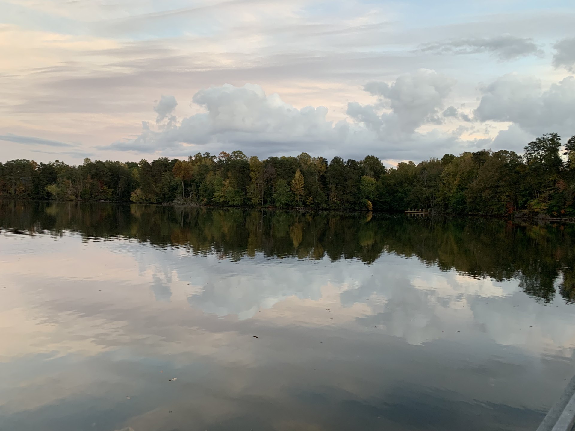 1 Corinthians 10 NASB.  Autumn trees and multicolored skies reflecting on a tranquil lake.