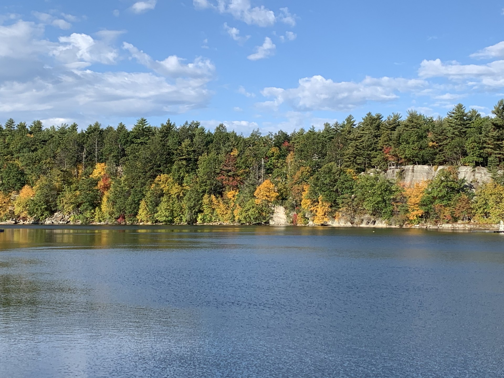 John 6 NASB.  Beautiful fall foliage rising from a tranquil lake.